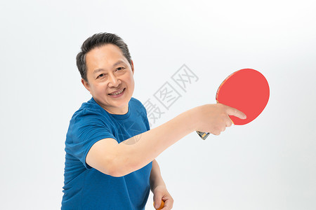 运动装退休老人打乒乓背景