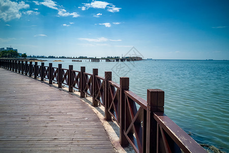 夏天悬崖海南海边栈桥背景