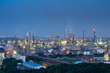 冷凝塔武钢集团夜幕下灯火通明的工厂厂房背景