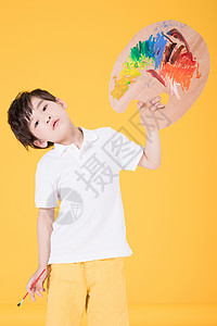 美术培训机构人物素材手持画板画画的小男孩儿童背景