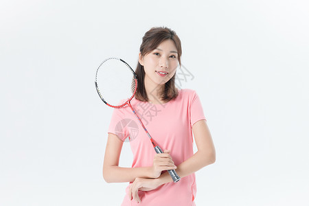 运动女性羽毛球背景图片