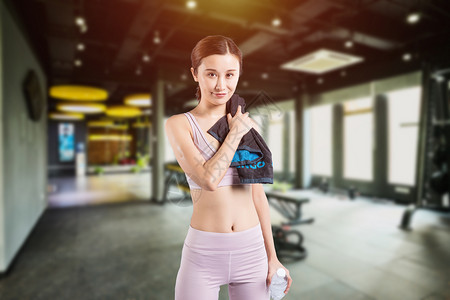 年轻女子运动健身热身图片健身房运动设计图片