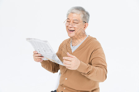 老年人戴眼镜看报纸背景