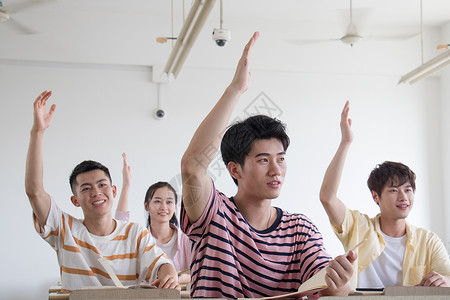 男生女生课堂举手背景图片