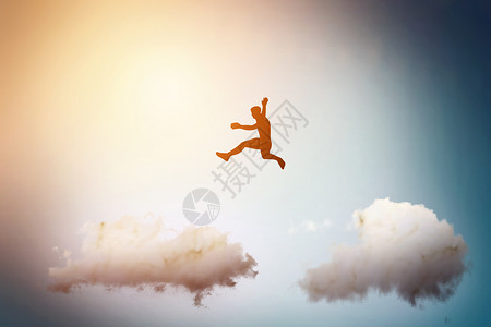 跳降落伞跨越云彩设计图片