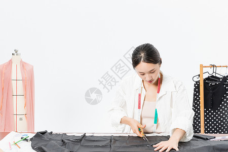 裁剪面料女设计师服装裁剪背景