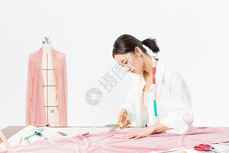 裁剪面料女设计师服装裁剪背景