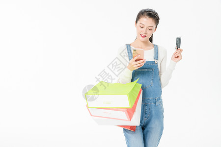 年轻女性购物手机移动支付图片