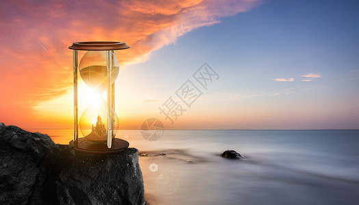 日落灯塔海边沙漏背景设计图片