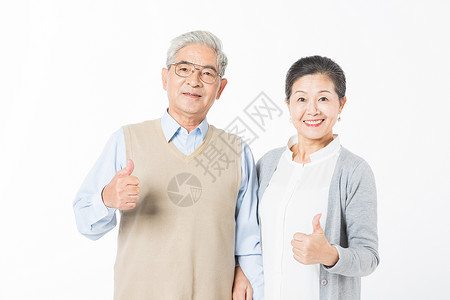 幸福的老年夫妻举大拇指背景图片