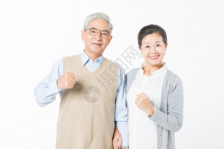 老人握拳幸福的老年夫妻加油背景
