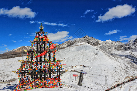 藏地文化康定白雪皑皑的折多山经幡塔背景