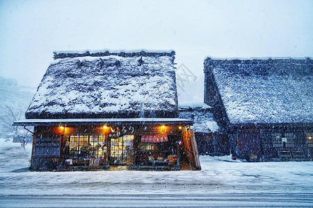 雪闪着白日本白川乡雪景背景
