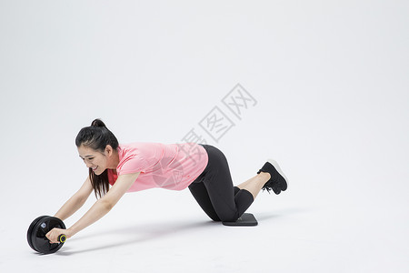 女性运动健腹轮背景图片