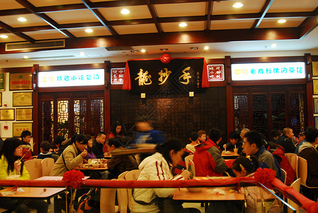 小餐饮店成都春熙路上龙抄手饮食店背景