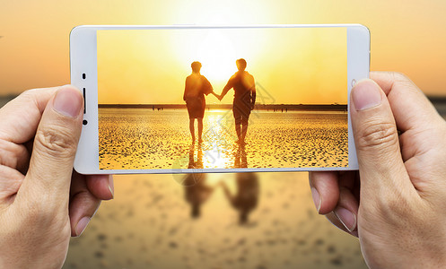 手机摄影海边情侣摄影高清图片