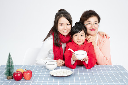 冬至节气女孩与汤圆插画温馨家庭吃汤圆背景