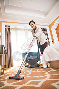 酒店客房吸尘器打扫卫生图片