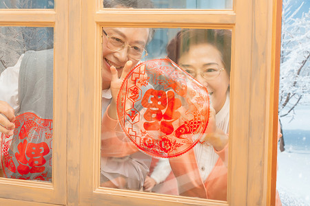 传统文化红色爷爷奶奶新春贴窗花背景