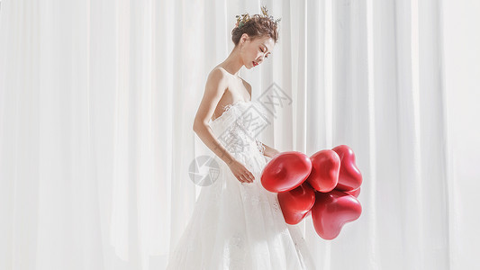 化妆新娘婚纱美女手持气球背景
