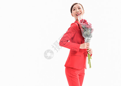 爱心红玫瑰花红西装女性手拿玫瑰背景