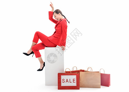 红西装女性购物促销背景图片