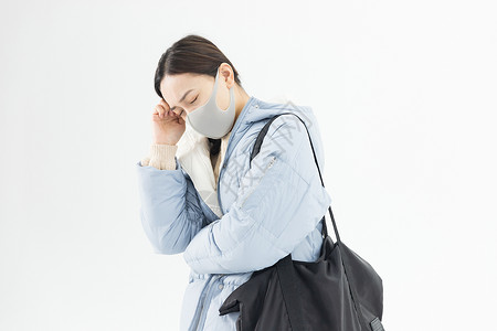 防尘口罩标识年轻女性头痛背景