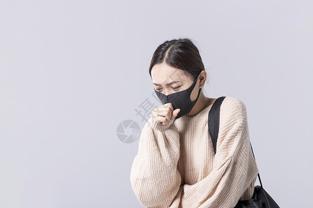 黑色口罩素材戴着口罩咳嗽的女孩背景
