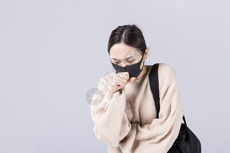 防尘面具戴着口罩咳嗽的女孩背景