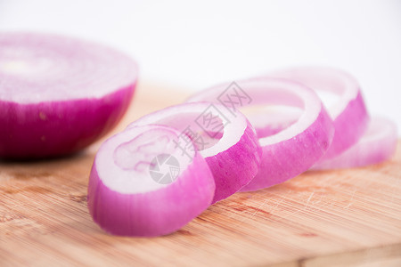 紫色球框新鲜蔬菜洋葱圈背景