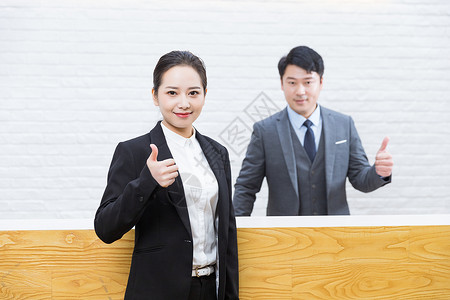 女人大拇指前台商务人士背景