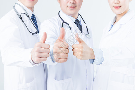 医疗团队比心特写年轻的医生们举大拇指特写背景