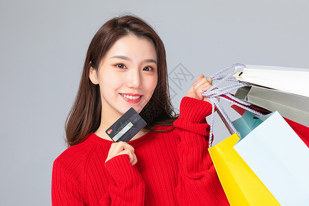 会员机制购物女性手拿信用卡背景