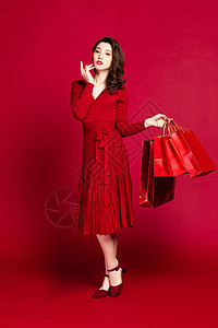 红色礼品袋女性购物形象背景