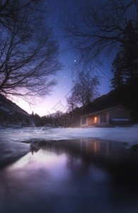天空下的雪星空下的小屋背景