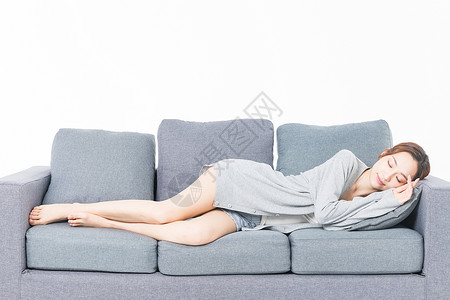 年轻女性沙发上睡觉背景图片