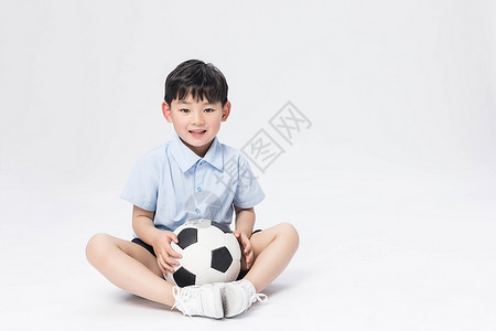 可爱的孩童玩足球的男孩背景