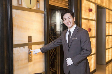 优质物业酒店服务员按电梯背景