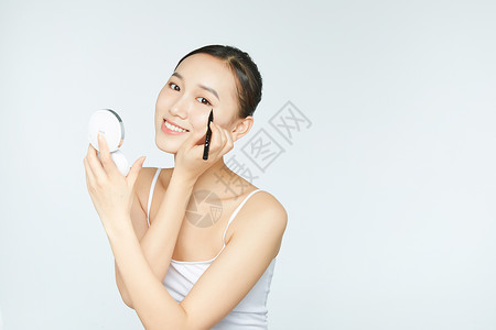 女性化妆化眼线背景图片