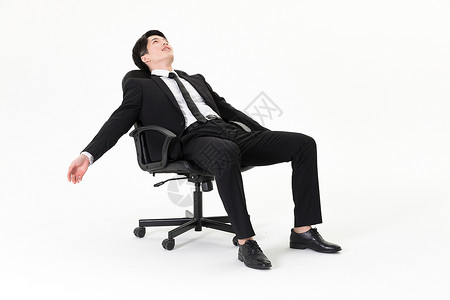 商务男性坐在椅子上图片