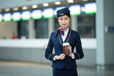 职业裙装空姐手拿护照机票背景