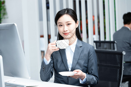 商务女性喝咖啡背景图片