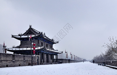 雨雾西安明城墙雪景背景