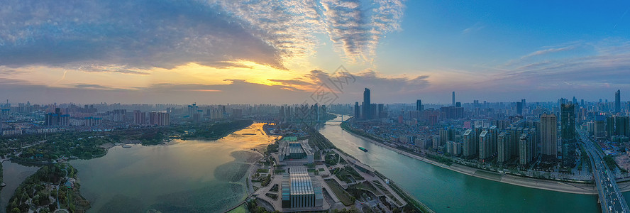 城市夕阳晚霞建筑群全景长片湖泊高清图片素材