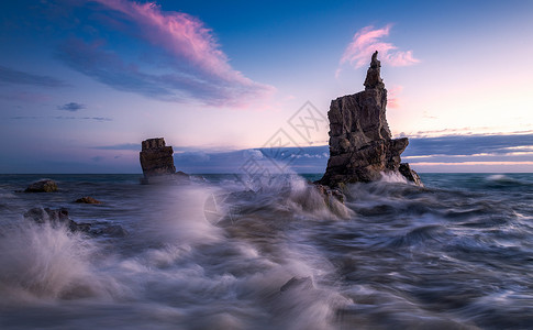 礁石夕阳海岸风光背景