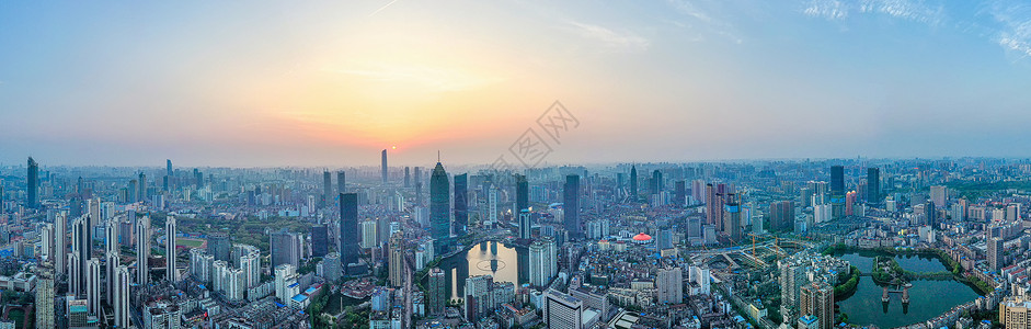 繁华城市建筑群夕阳落日全景长图背景图片