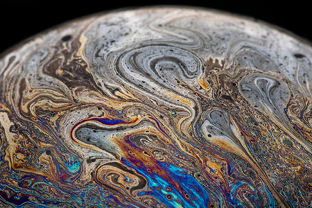 彩色星球表面彩色的肥皂泡泡背景