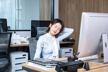 办公女性久坐劳累背景图片