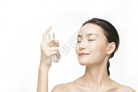 美妆水使用化妆品的护肤美女背景