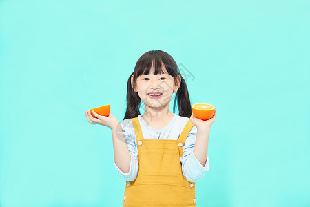 开心的橙子小女孩吃橙子背景